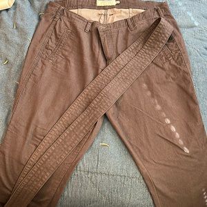 Dark gray pants with belt.